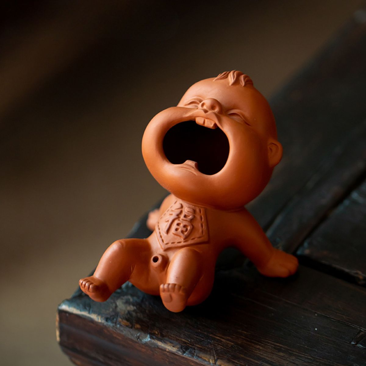 Zhuni Red Clay Tea Pet – Playful Water-Spouting Boy Figurine