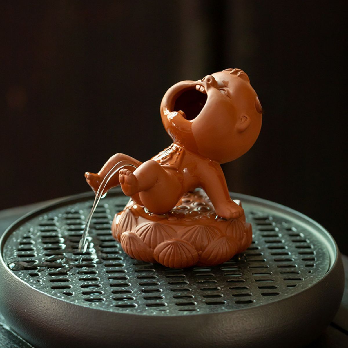 Zhuni Red Clay Tea Pet – Playful Water-Spouting Boy Figurine