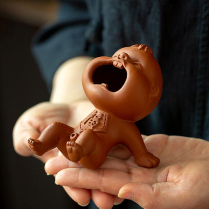 Zhuni Red Clay Tea Pet – Playful Water-Spouting Boy Figurine