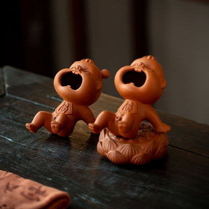 Zhuni Red Clay Tea Pet – Playful Water-Spouting Boy Figurine