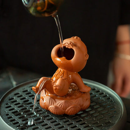 Zhuni Red Clay Tea Pet – Playful Water-Spouting Boy Figurine